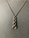4 Ring Mobius Pendant