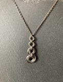 4 Ring Mobius Pendant